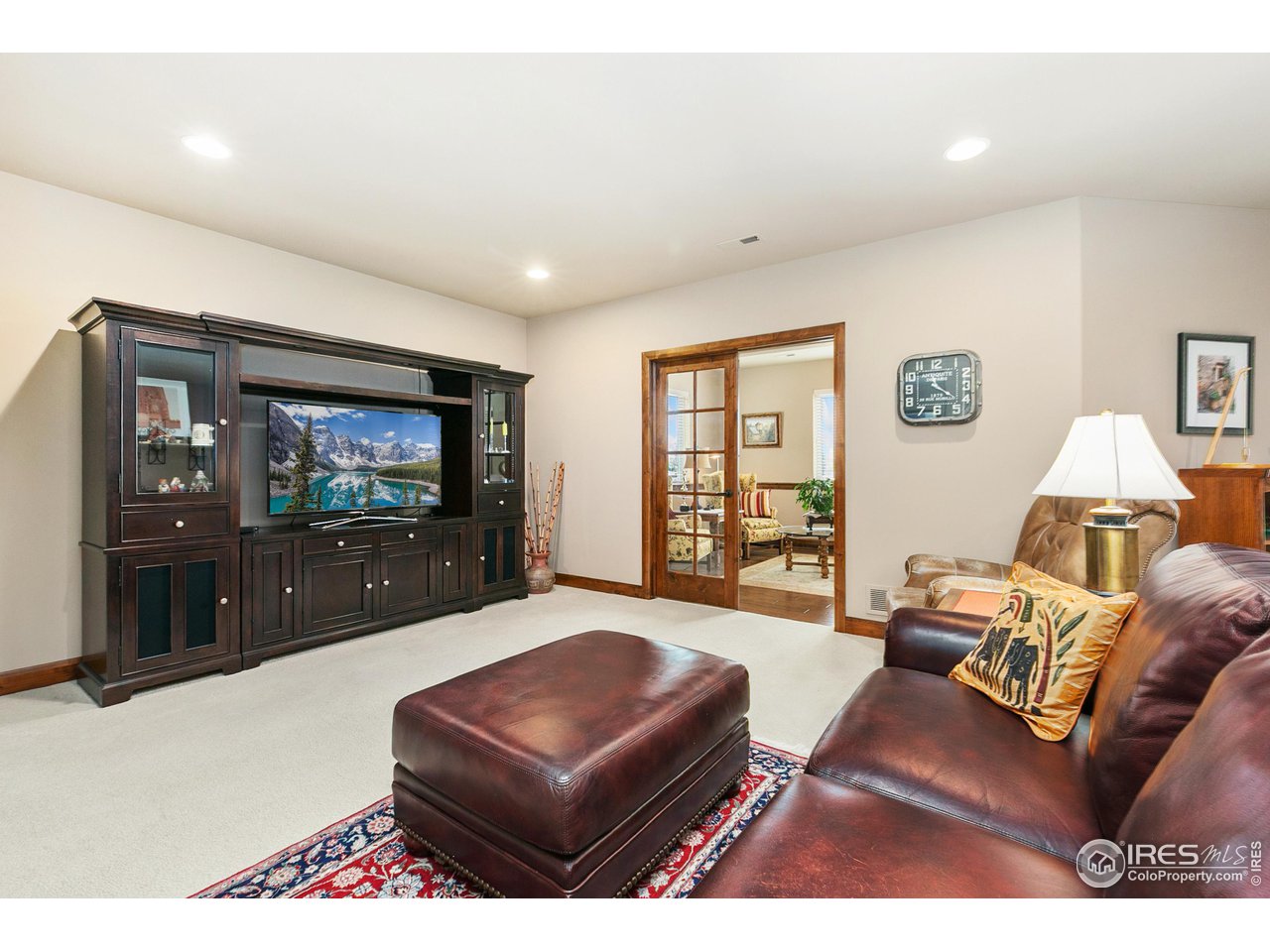 6701 Clovis Court Timnath, CO 80547 - Photo 16 of 40 a living room with furniture and a flat screen tv