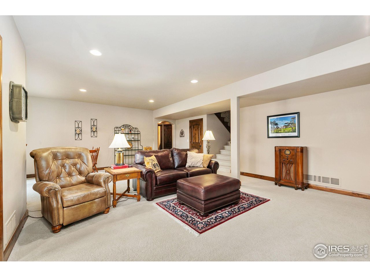 6701 Clovis Court Timnath, CO 80547 - Photo 17 of 40 a living room with furniture a flat screen tv and a window