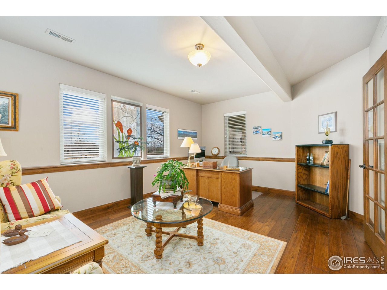 6701 Clovis Court Timnath, CO 80547 - Photo 18 of 40 a living room with furniture and a table