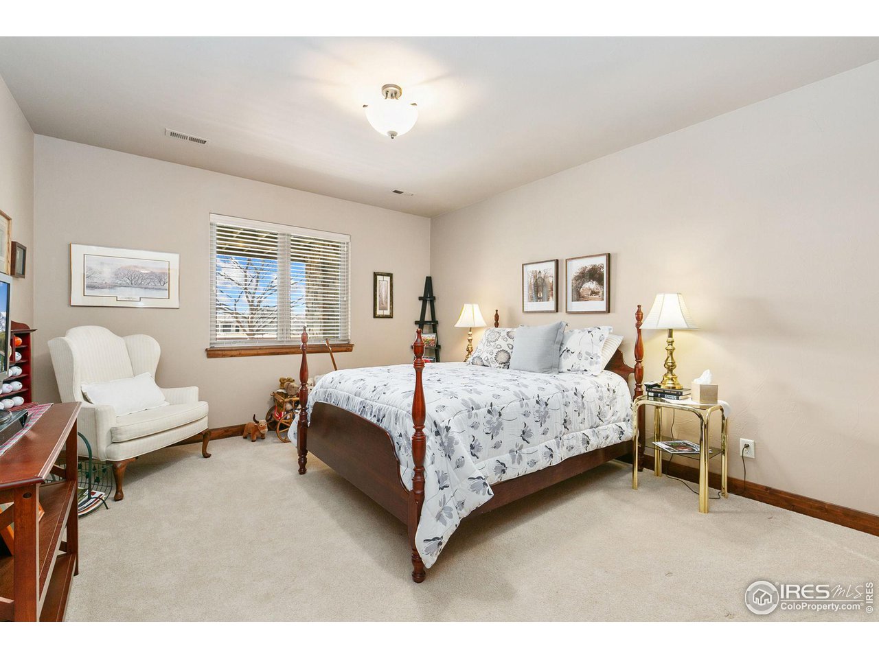 6701 Clovis Court Timnath, CO 80547 - Photo 23 of 40 a bed room with a bed and a chair