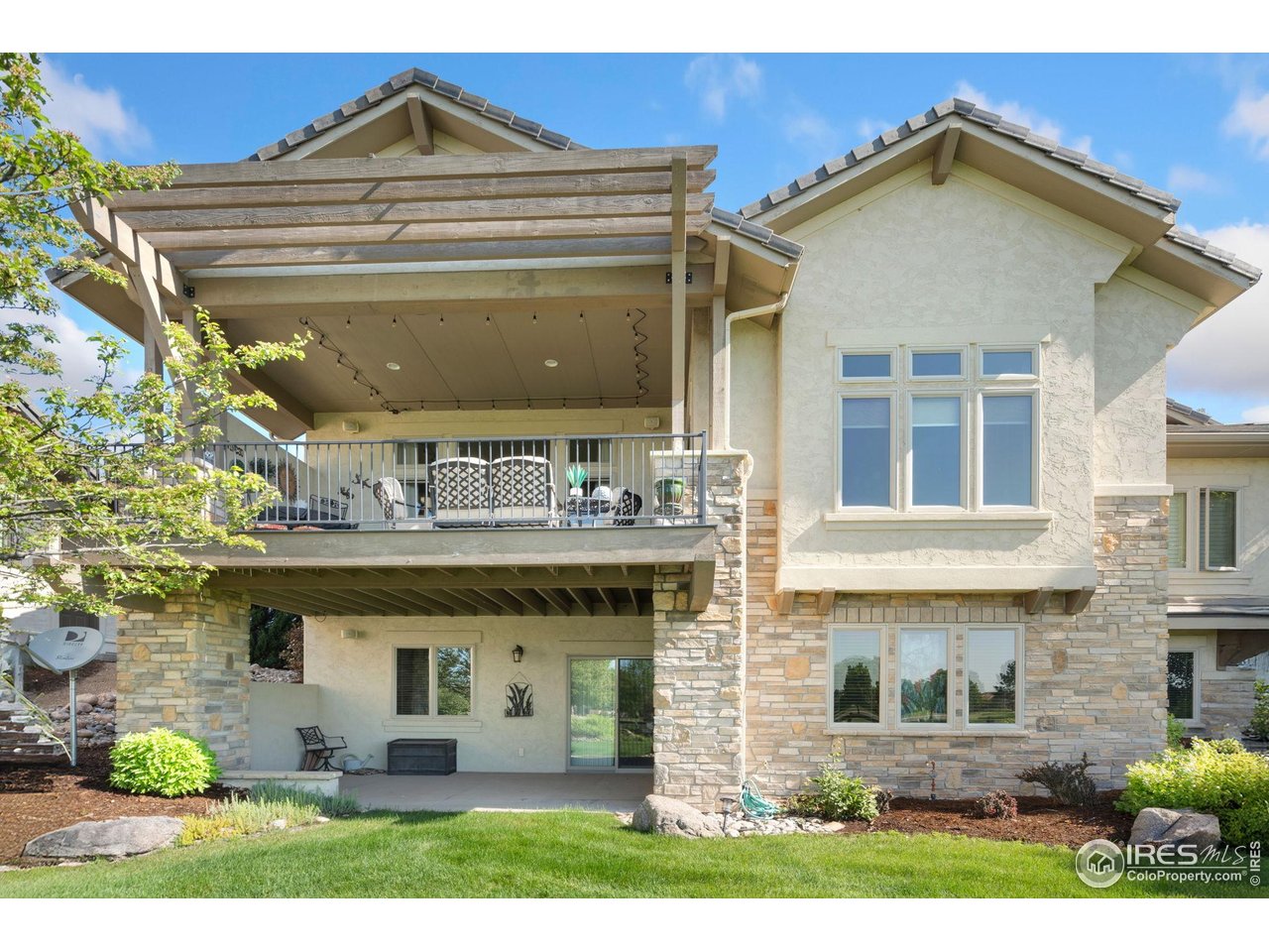 6701 Clovis Court Timnath, CO 80547 - Photo 26 of 40 a front view of a house with garden