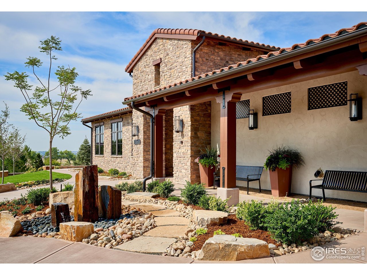 6701 Clovis Court Timnath, CO 80547 - Photo 33 of 40 a front view of a house with garden