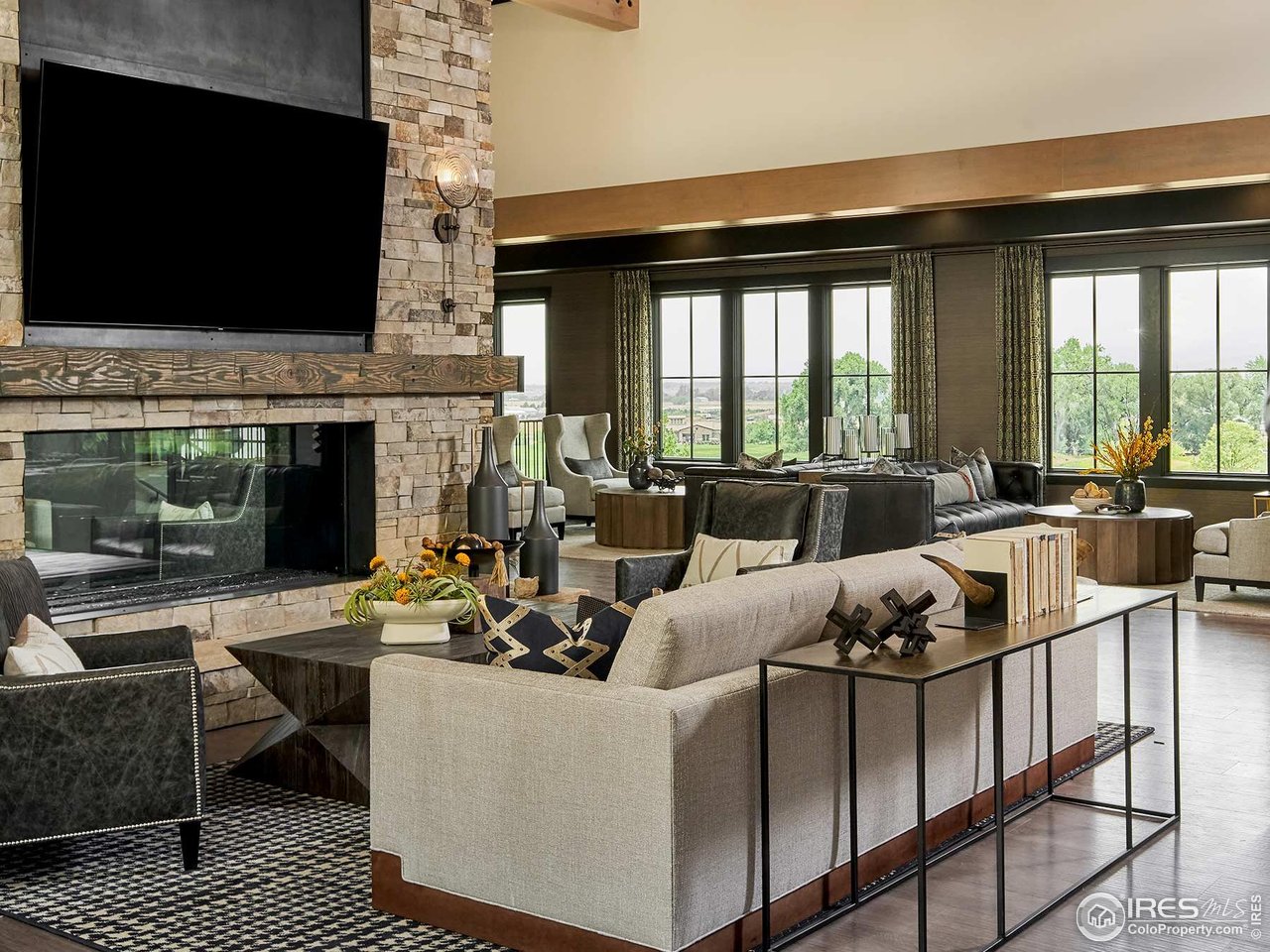 6701 Clovis Court Timnath, CO 80547 - Photo 35 of 40 a living room with furniture fireplace and flat screen tv