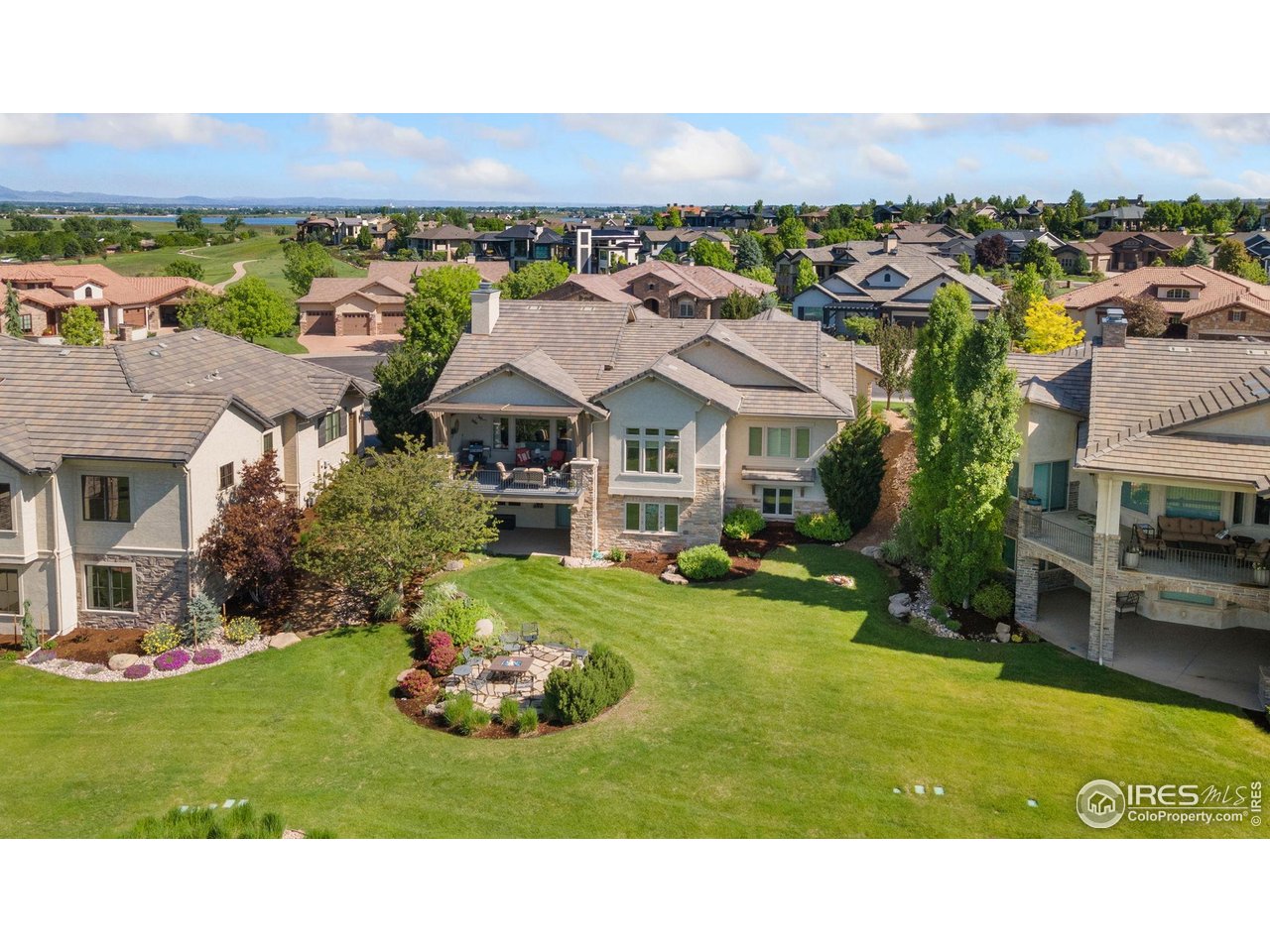 6701 Clovis Court Timnath, CO 80547 - Photo 5 of 40 a aerial view of a house with a garden and lake view