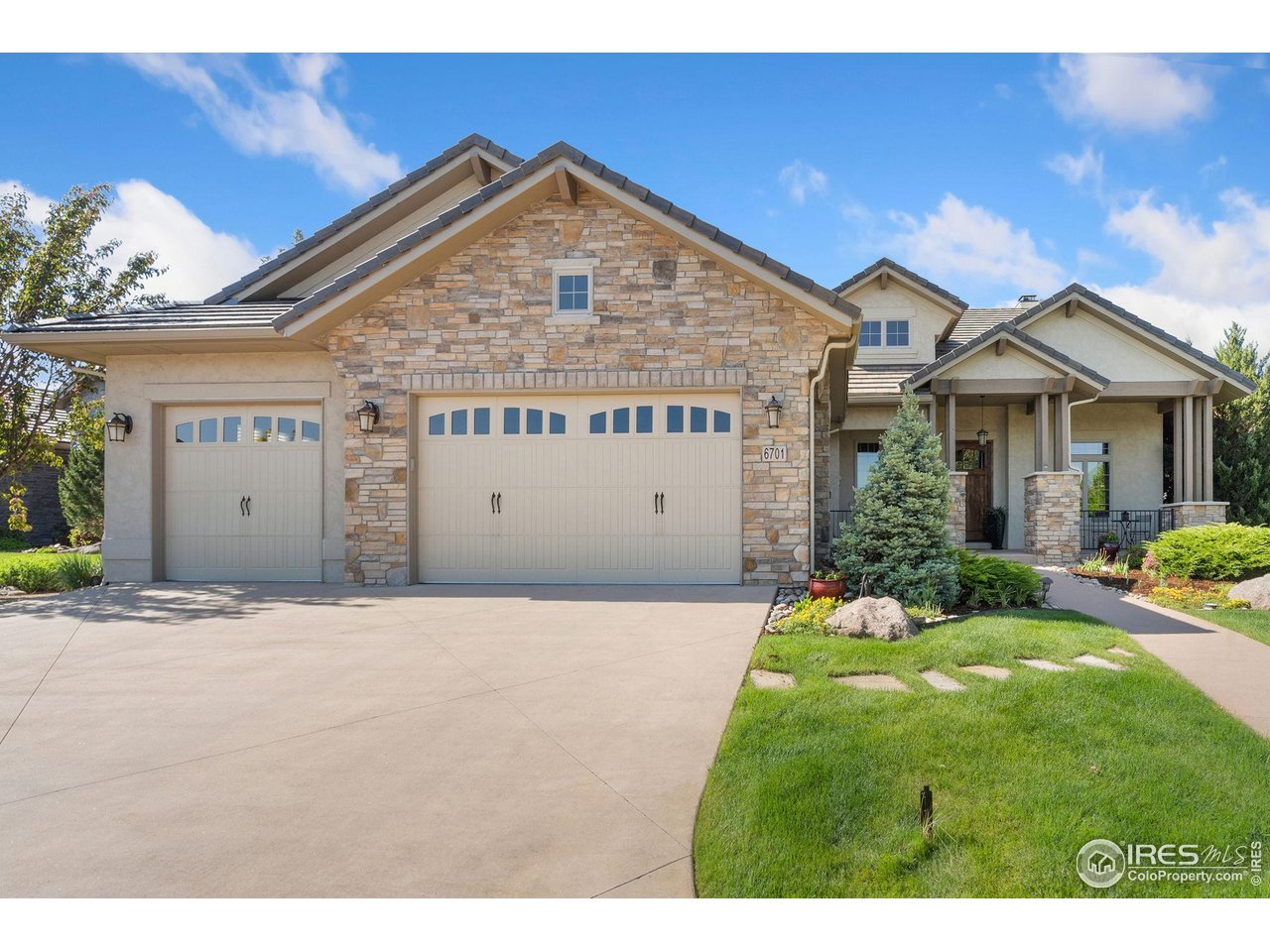 6701 Clovis Court Timnath, CO 80547 - Photo 6 of 40 a front view of a house with a yard