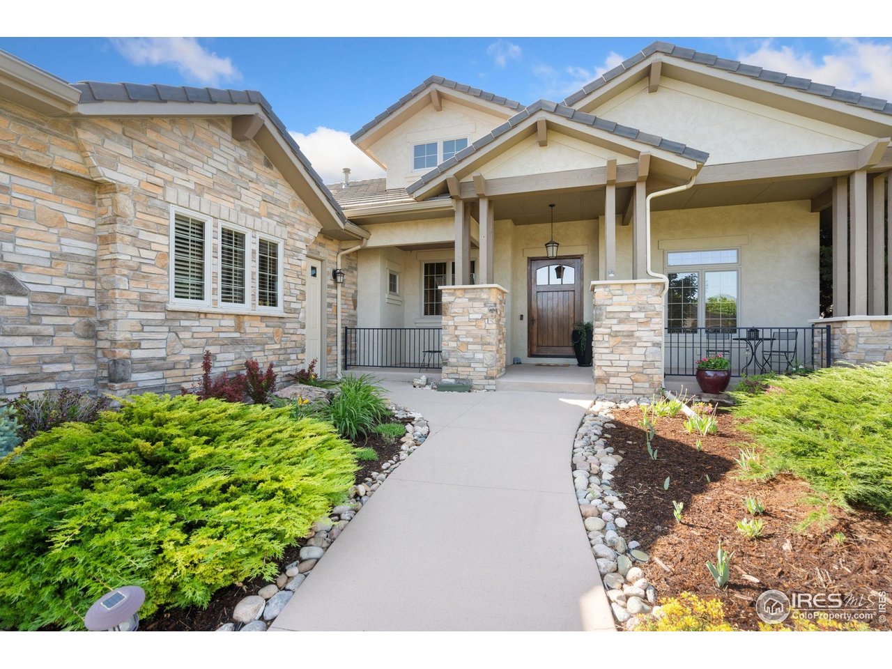 6701 Clovis Court Timnath, CO 80547 - Photo 7 of 40 a front view of a house with a garden