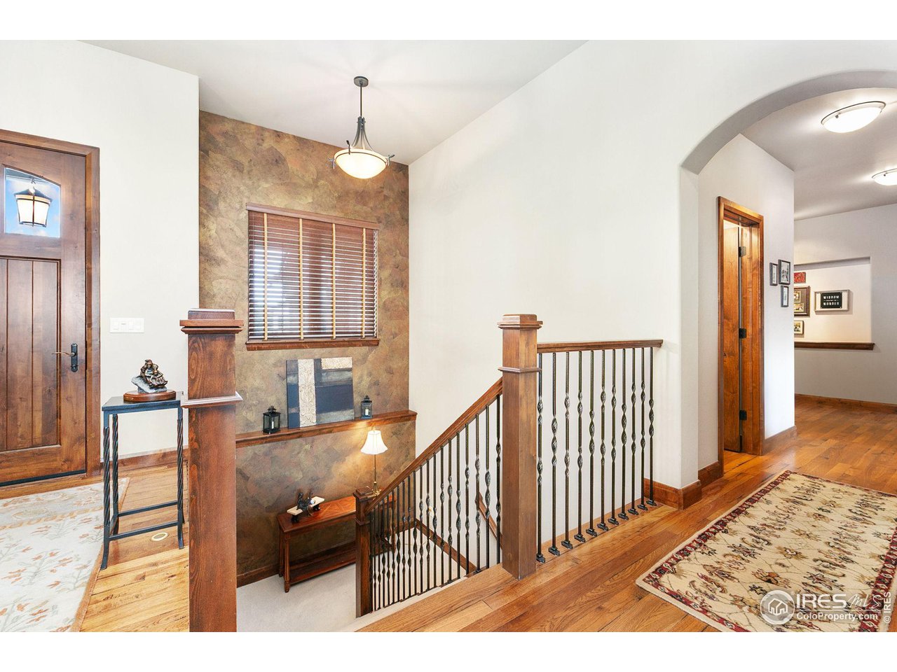 6701 Clovis Court Timnath, CO 80547 - Photo 9 of 40 a view of a hallway with furniture and windows