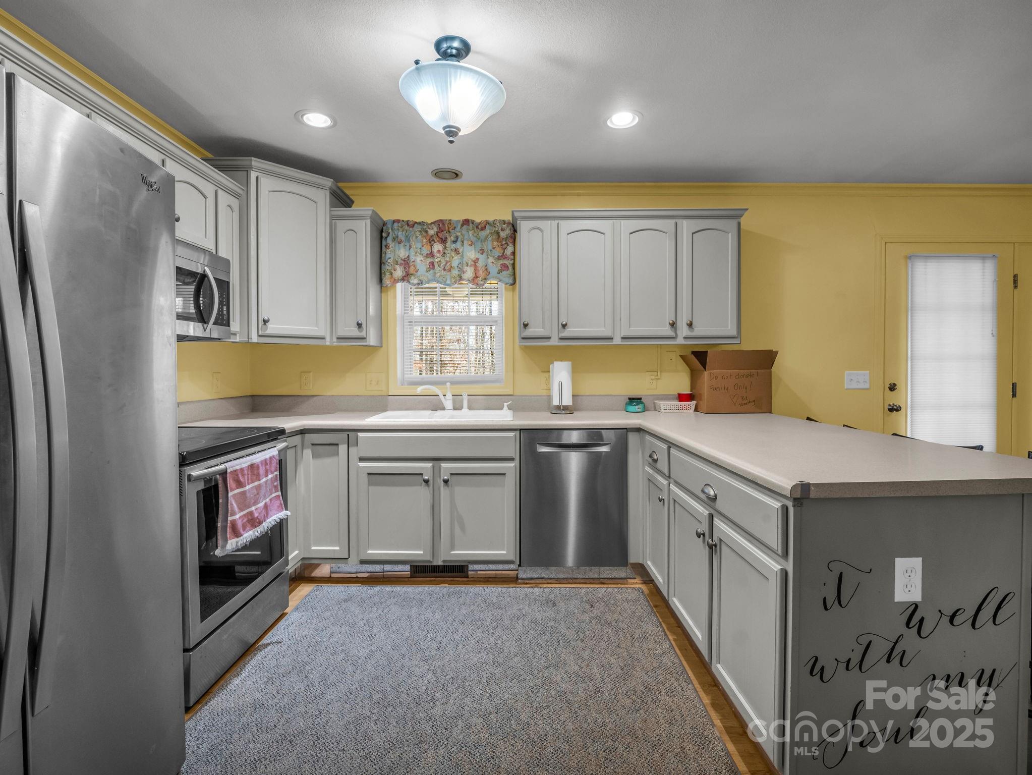 1095 Centennial Road Union Mills, NC 28167 - Photo 25 of 34 a kitchen with a sink stove and refrigerator