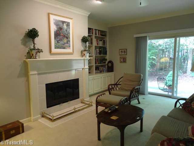 1005 Nuthatch Court High Point, NC 27262 - Photo 5 of 16 Den/Family/Great Room. Doors lead to private patio overlooking wooded area