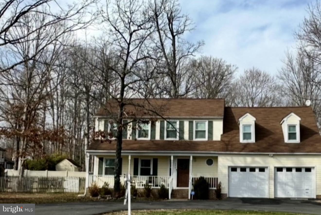 386 Ferry Road Fredericksburg, VA 22405 - Photo 1 of 2 a front view of a building with lots of trees