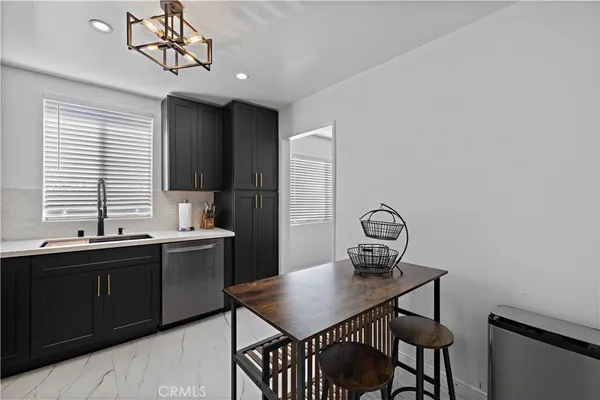 a view of a dining room with furniture and window
