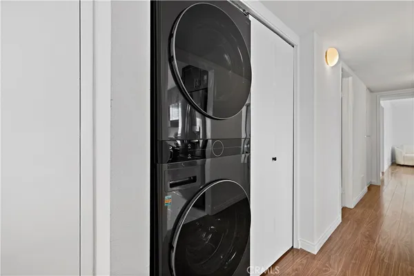 a view of a hallway with washer and dryer
