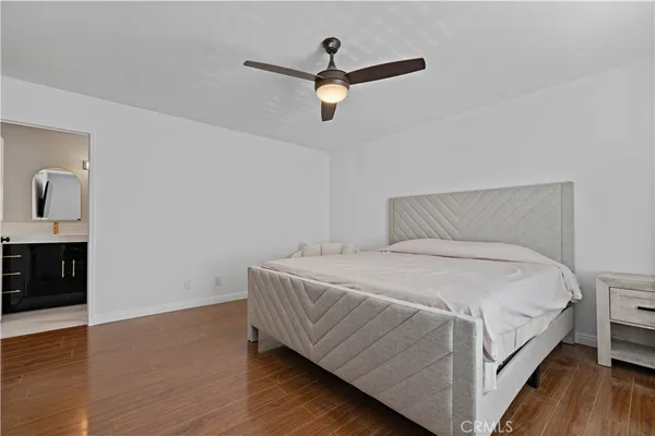 a bedroom with a bed and a couch