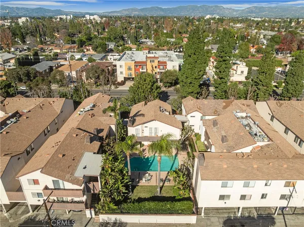 an aerial view of a house with a garden