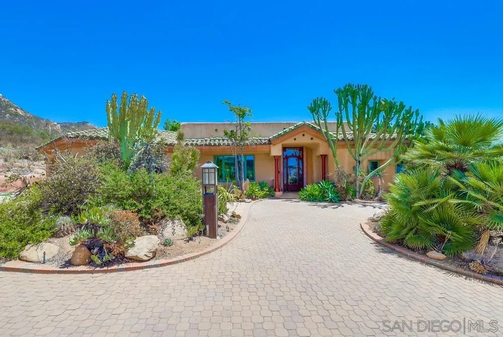15706 Lyons Valley Road Jamul, CA 91935 - Photo 2 of 50 a view of a garden with a building in the background