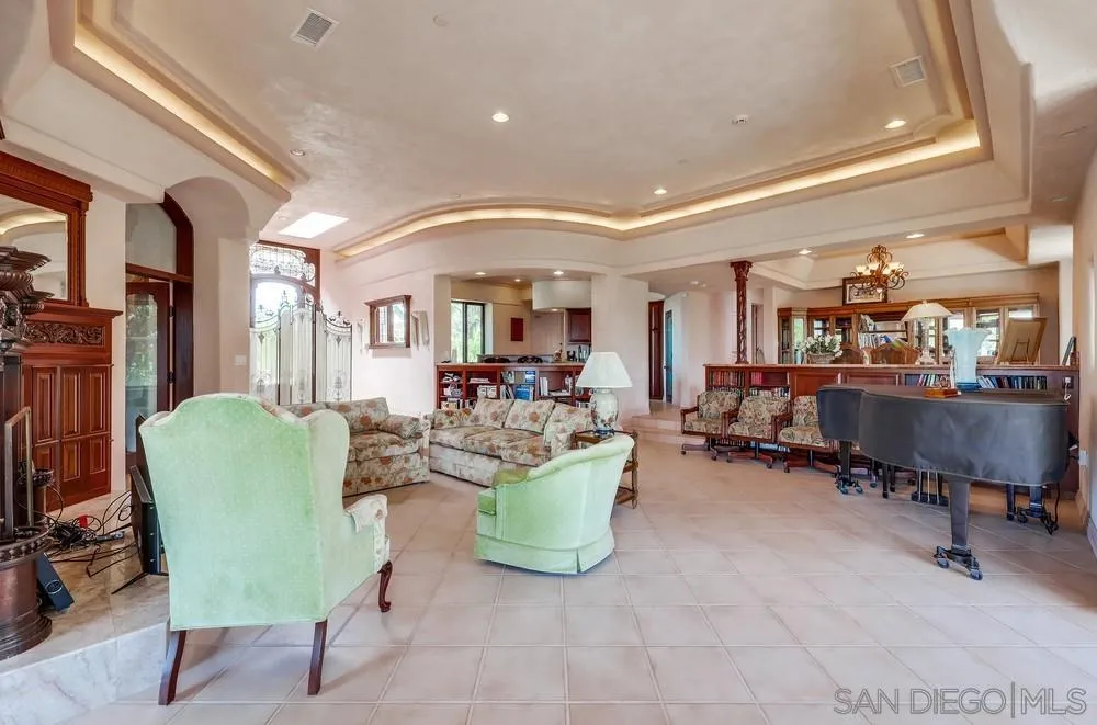 15706 Lyons Valley Road Jamul, CA 91935 - Photo 10 of 50 a living room with furniture and a chair