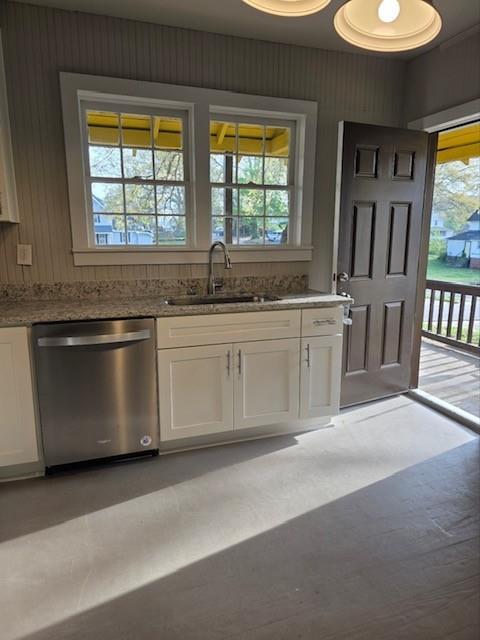 219 Grove Avenue Southeast Lindale, GA 30147 - Photo 3 of 39 a kitchen with stainless steel appliances granite countertop a stove a sink and a microwave