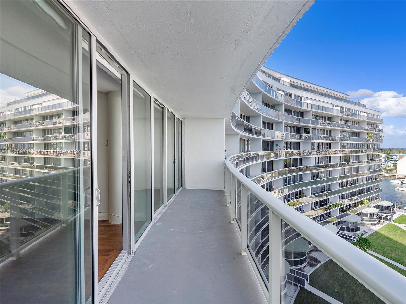 Normandy Isle Miami Beach, FL 33141 - Photo 22 of 43 a view of balcony with wooden floor and fence
