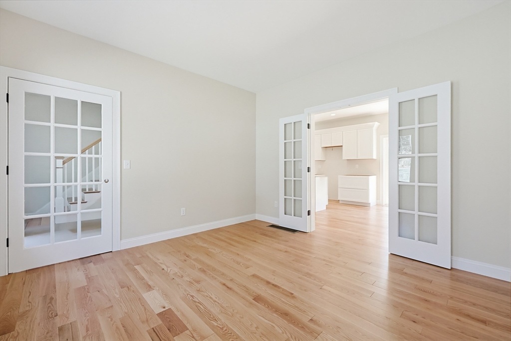 112 West Meadow Road Townsend, MA 01474 - Photo 15 of 38 an empty room with wooden floor and windows