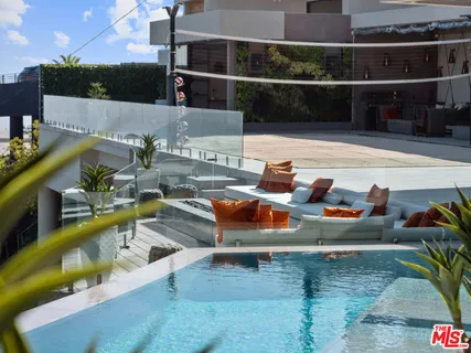 a view of a patio with swimming pool