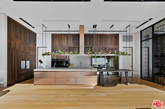 a view of a living room and kitchen