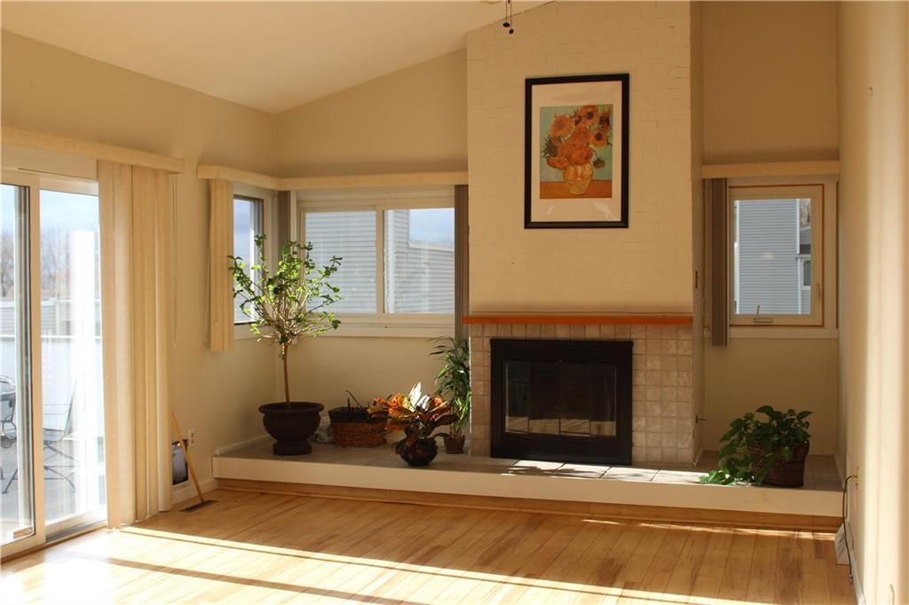 17 Stratton Way, Unit 17 Branford, CT 06405 - Photo 1 of 1 a living room with furniture and a fireplace