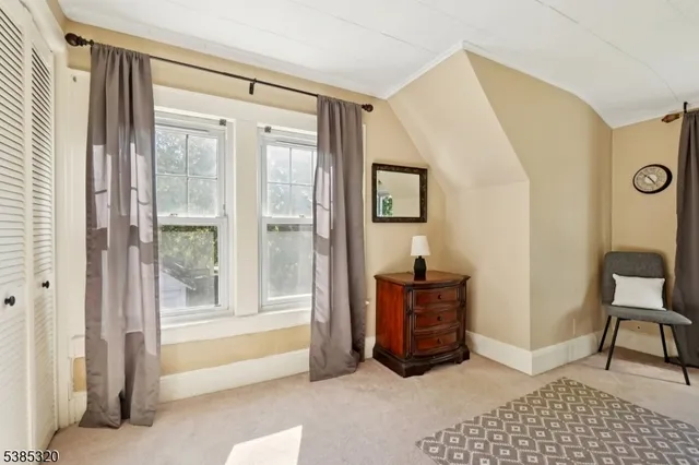 a view of a livingroom with furniture and cabinet