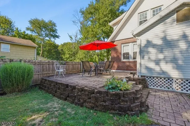 a view of a backyard with plants and a garden