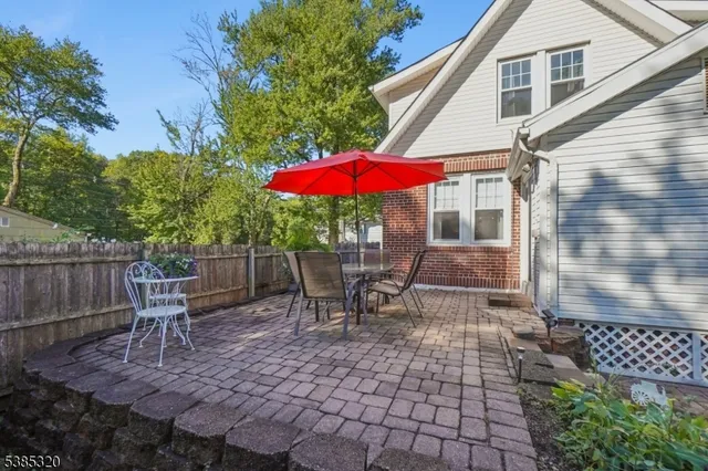 a patio with a table and chairs