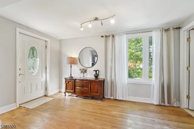 a view of room with window and wooden floor