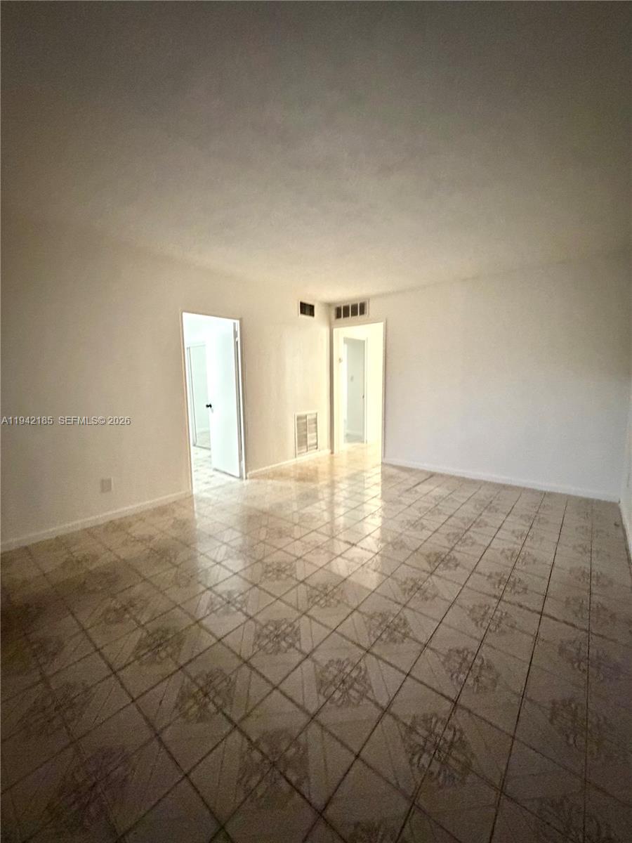 958 East 21st Street Hialeah, FL 33013 - Photo 13 of 16 a view of an empty room and window
