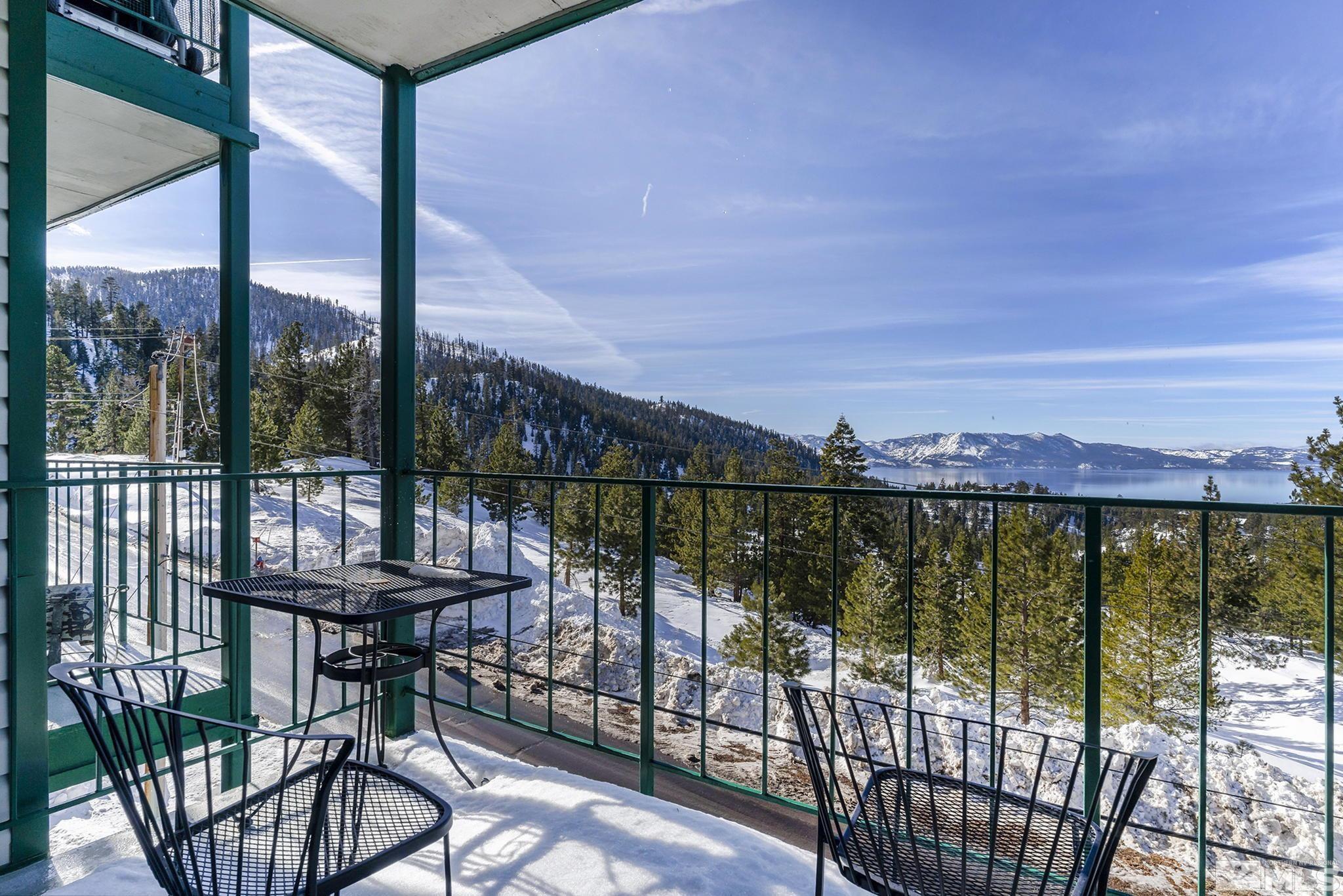a view of a balcony with lake view and mountain view