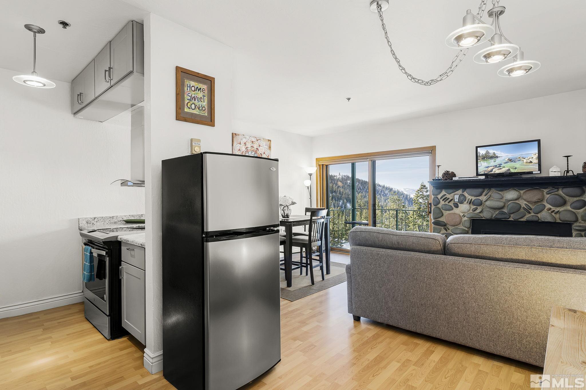 313 Tramway Drive, Unit 13 Stateline, NV 89449 - Photo 11 of 24 a living room with furniture and a fireplace