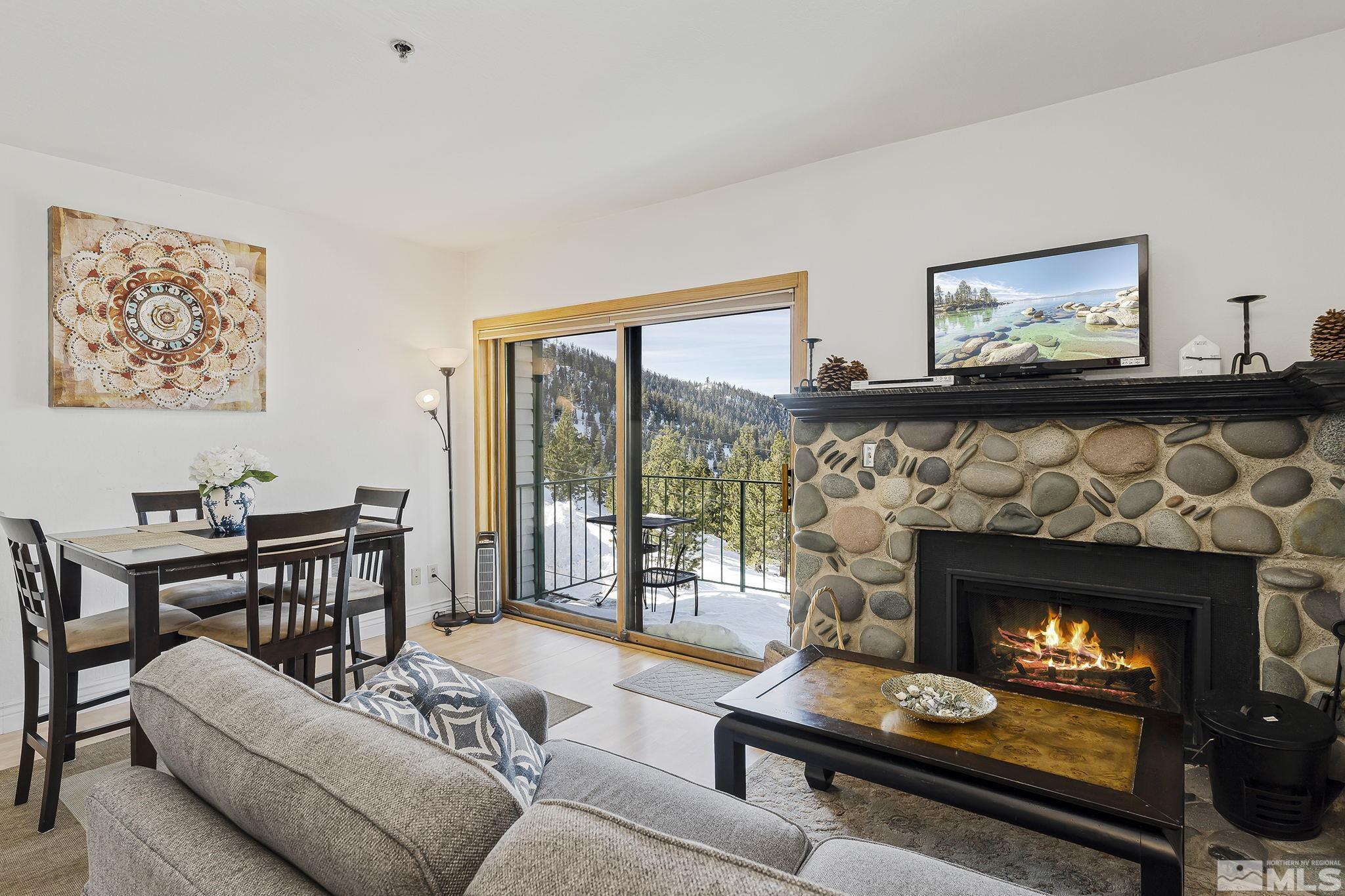 313 Tramway Drive, Unit 13 Stateline, NV 89449 - Photo 12 of 24 a living room with furniture and a fireplace
