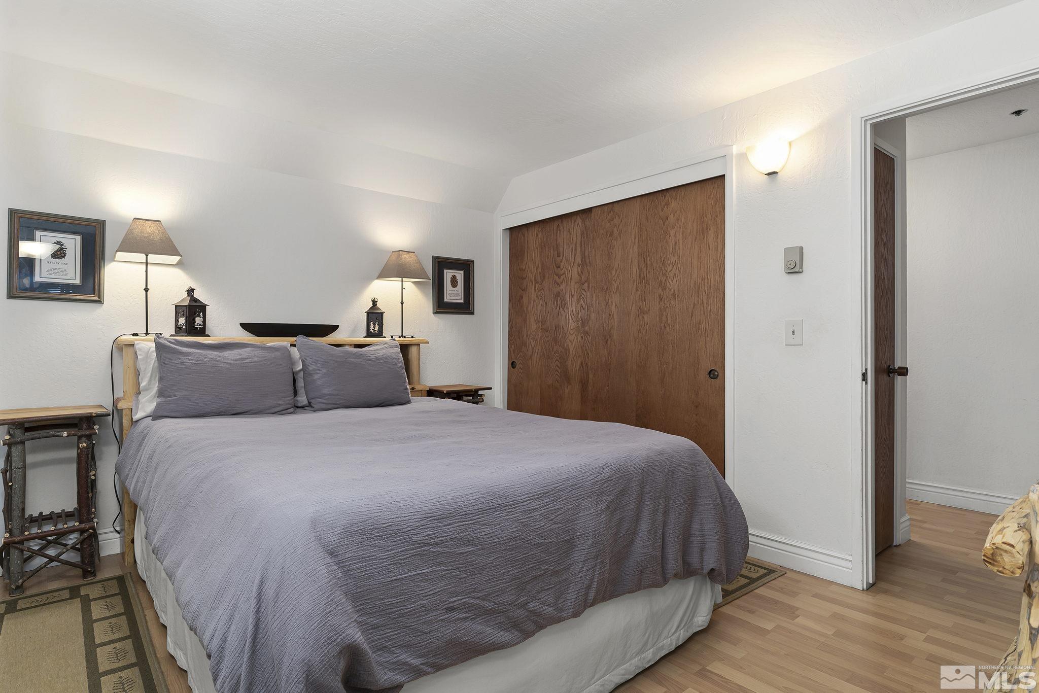 313 Tramway Drive, Unit 13 Stateline, NV 89449 - Photo 17 of 24 a bed room with a bed and a mirror