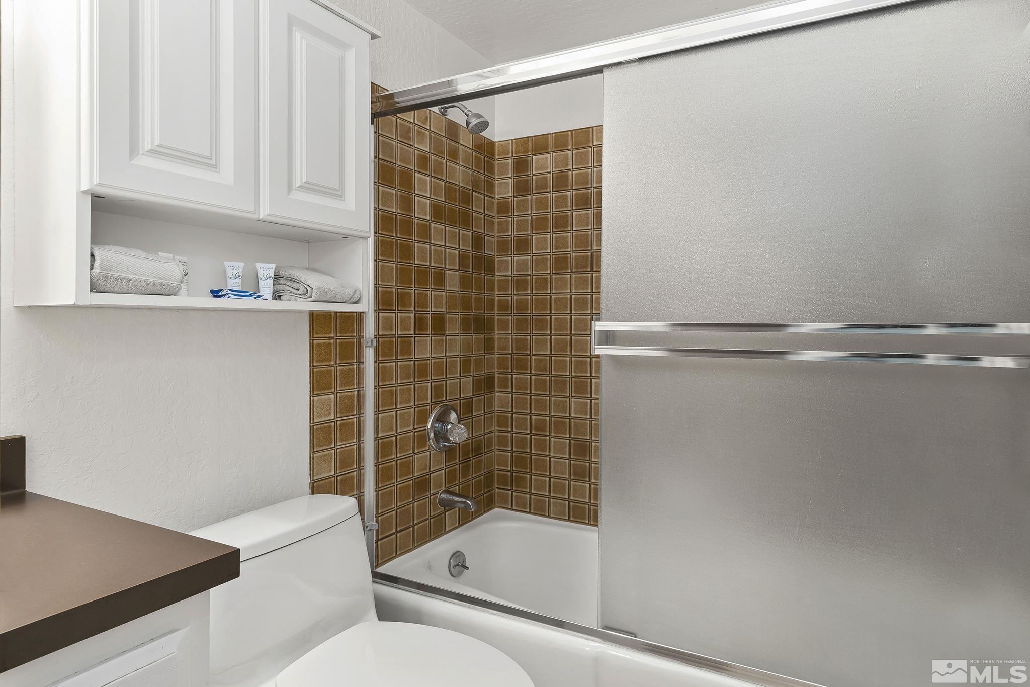 313 Tramway Drive, Unit 13 Stateline, NV 89449 - Photo 19 of 24 a bathroom with a shower and a toilet