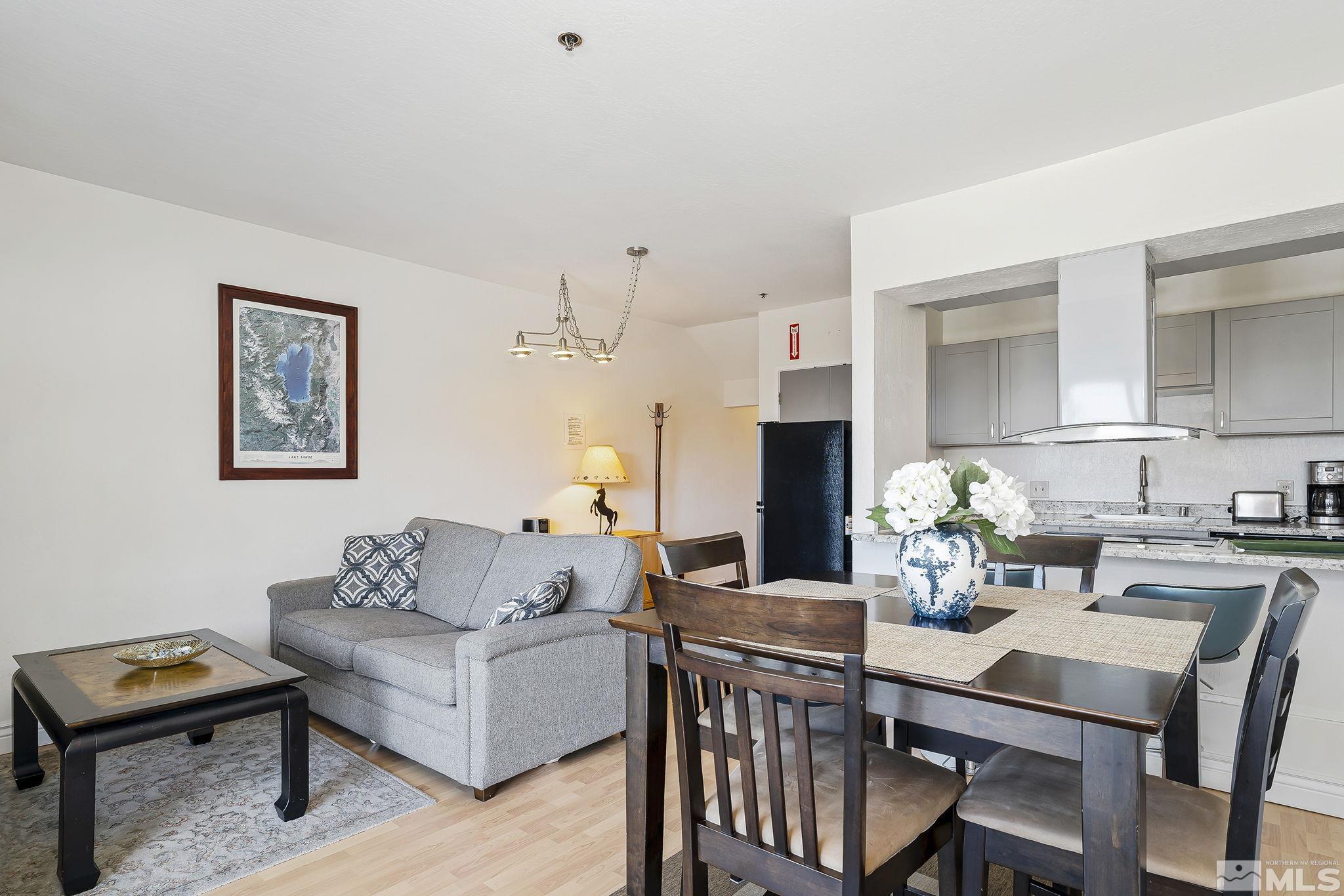 313 Tramway Drive, Unit 13 Stateline, NV 89449 - Photo 3 of 24 a living room with furniture and a dining table