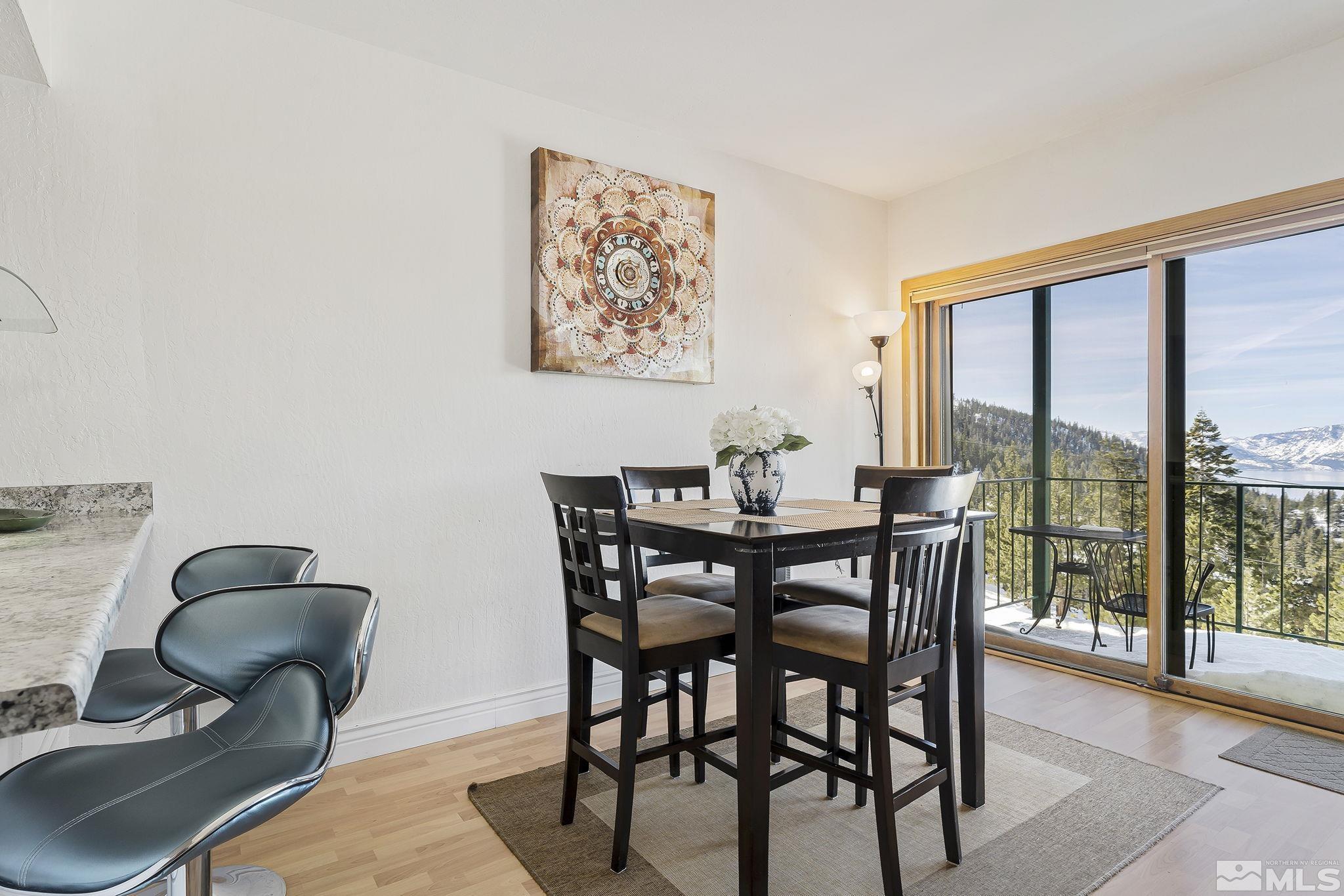 313 Tramway Drive, Unit 13 Stateline, NV 89449 - Photo 5 of 24 a dining room with furniture and wooden floor
