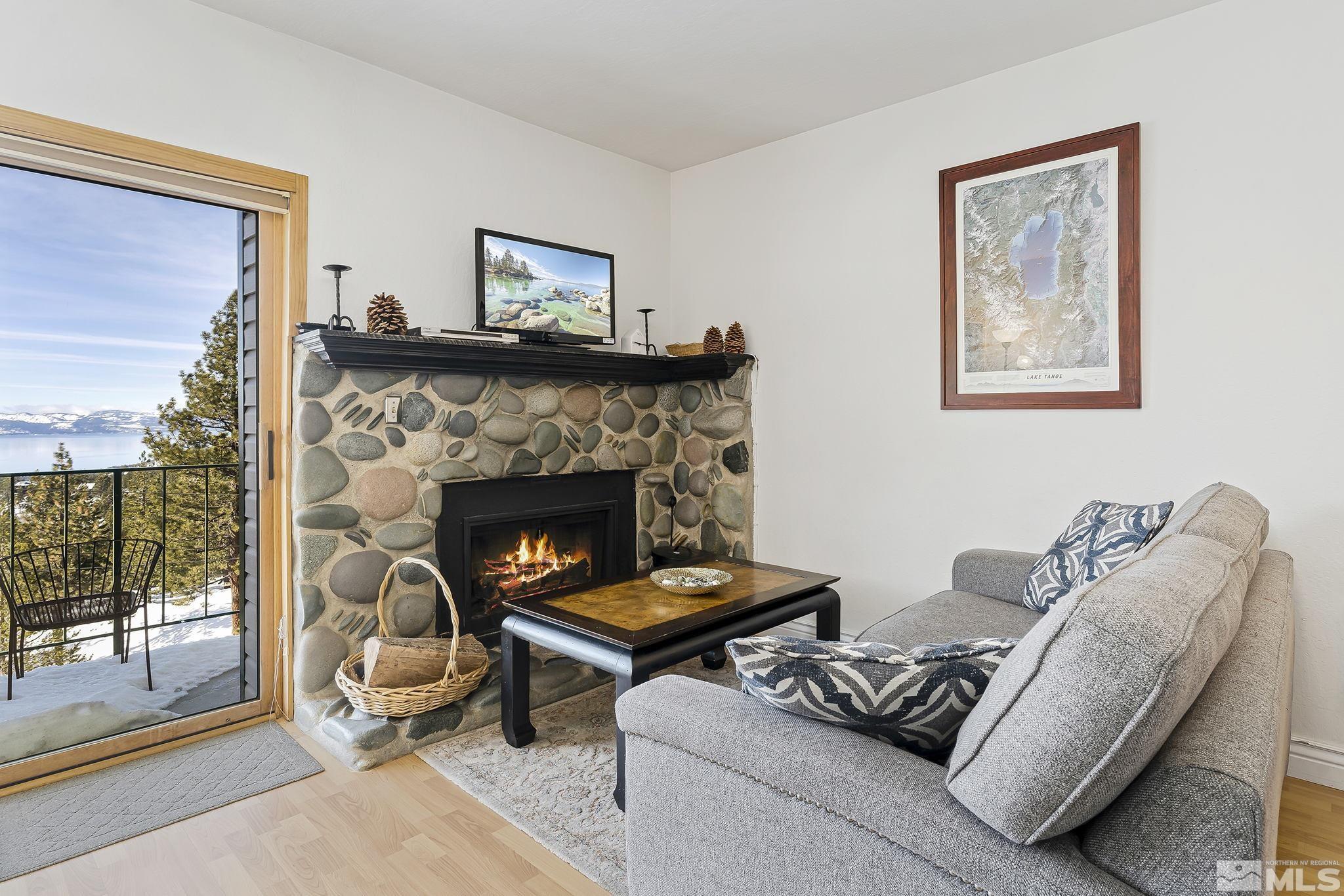 313 Tramway Drive, Unit 13 Stateline, NV 89449 - Photo 8 of 24 a living room with furniture and a fireplace
