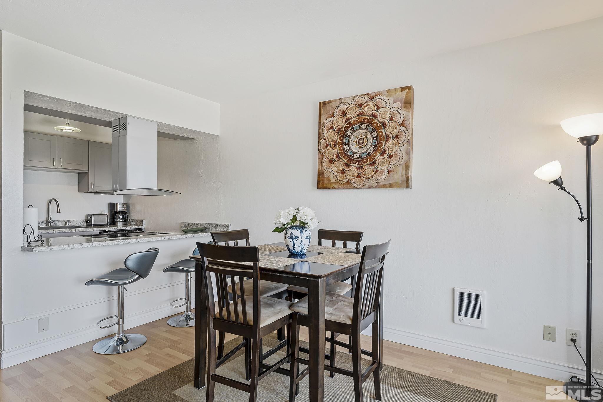 313 Tramway Drive, Unit 13 Stateline, NV 89449 - Photo 9 of 24 a view of a dining room that has a table and chairs in it