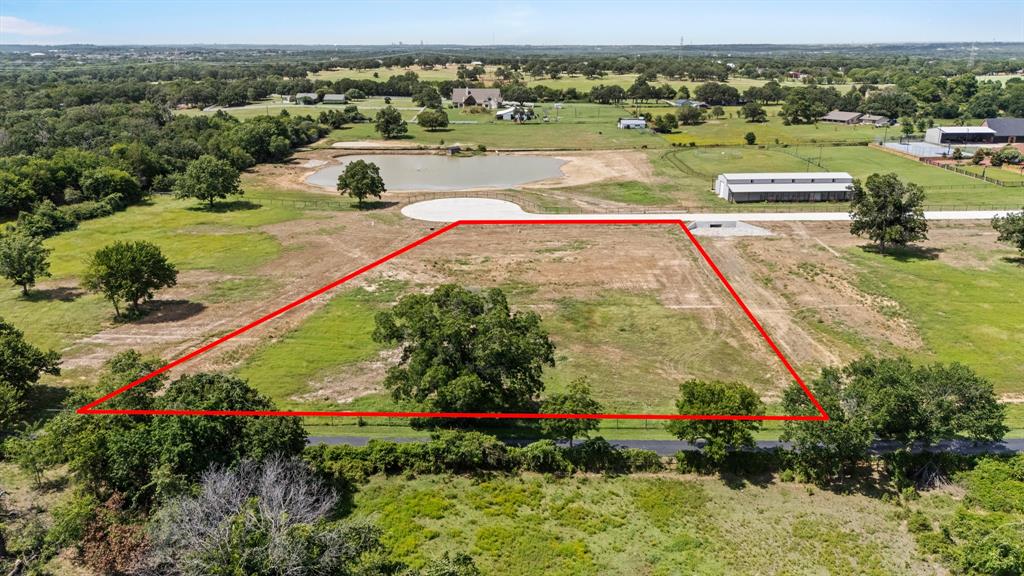Aerial view of property's location featuring property parcel outlined