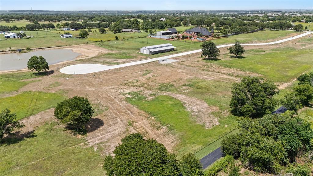 630 Singh Road Copper Canyon, TX 75077 - Photo 4 of 10 Aerial view of a large body of water and a tree filled landscape