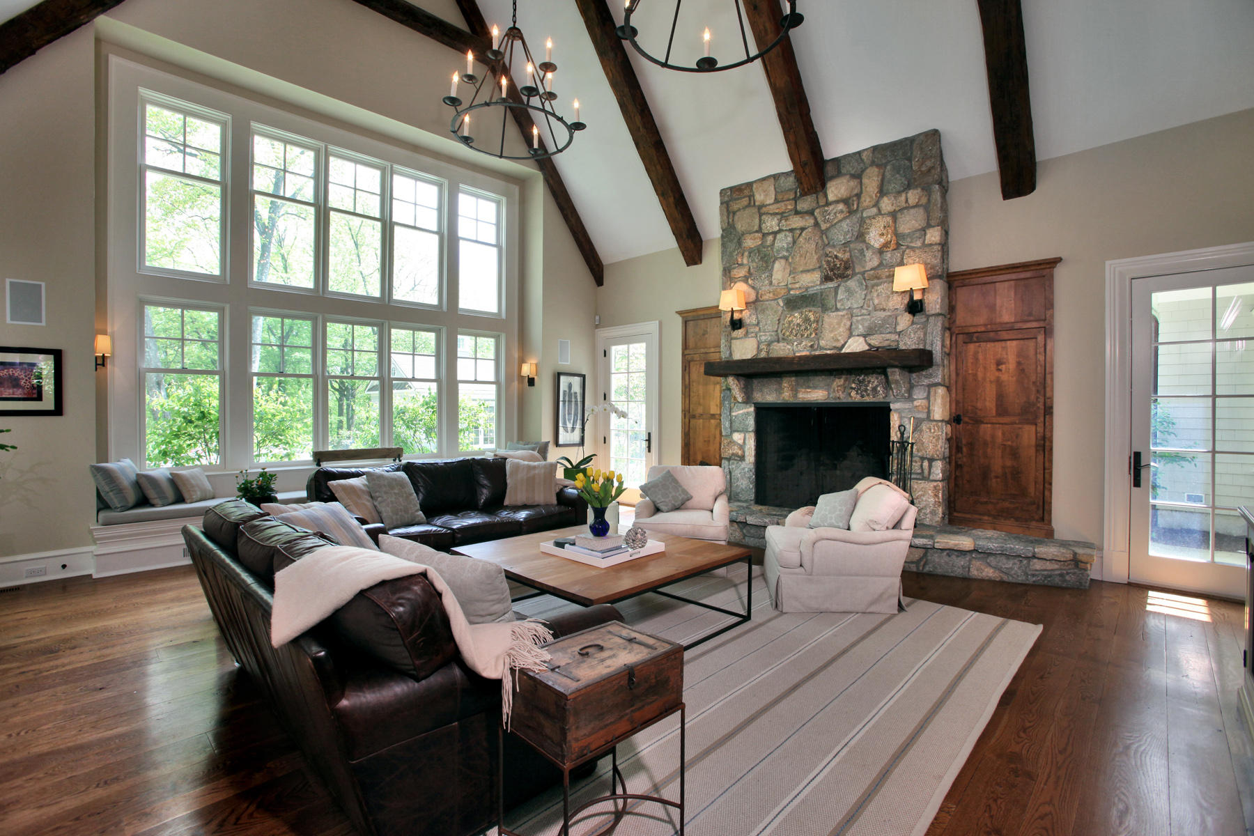 153 Chichester Road New Canaan, CT 06840 - Photo 12 of 32 a living room with furniture large window and wooden floor