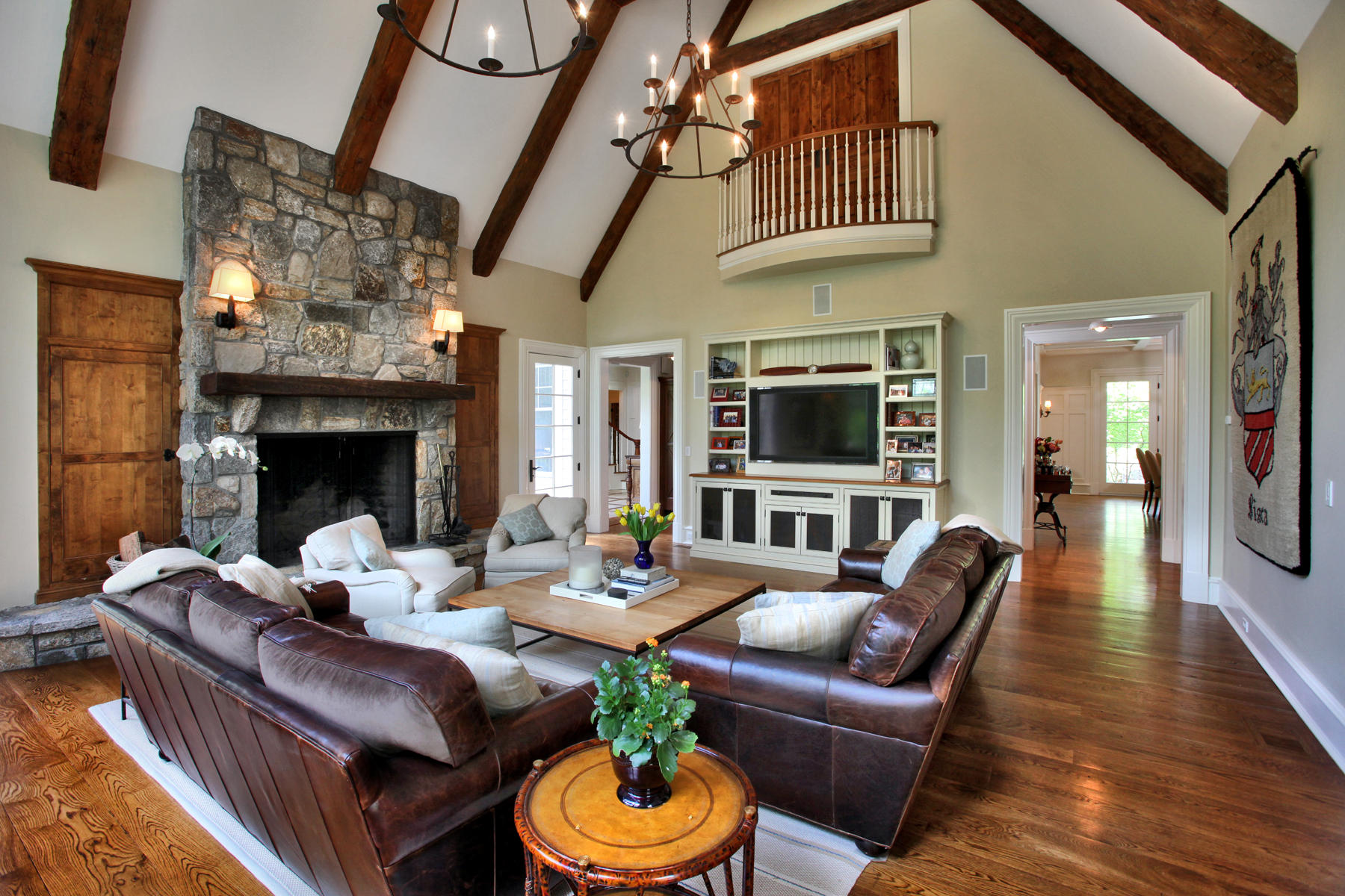 153 Chichester Road New Canaan, CT 06840 - Photo 13 of 32 a living room with furniture a fireplace and a flat screen tv