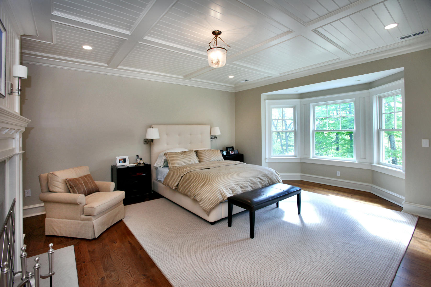153 Chichester Road New Canaan, CT 06840 - Photo 19 of 32 a spacious bedroom with a bed and a large window