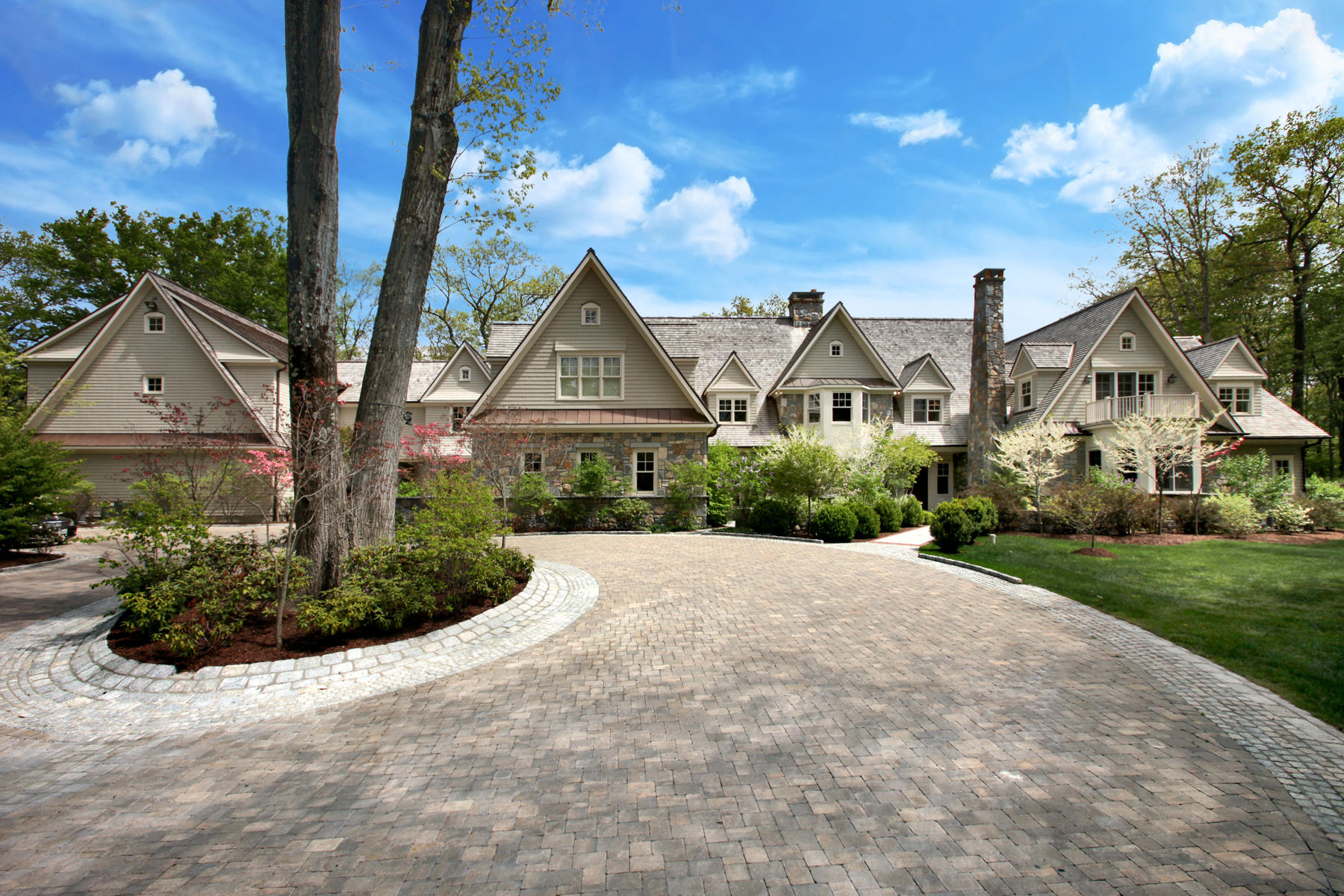 153 Chichester Road New Canaan, CT 06840 - Photo 2 of 32 a front view of a house with garden