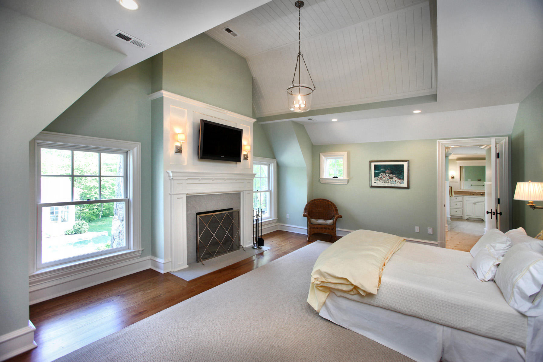 153 Chichester Road New Canaan, CT 06840 - Photo 21 of 32 a bedroom with a large bed and a flat screen tv