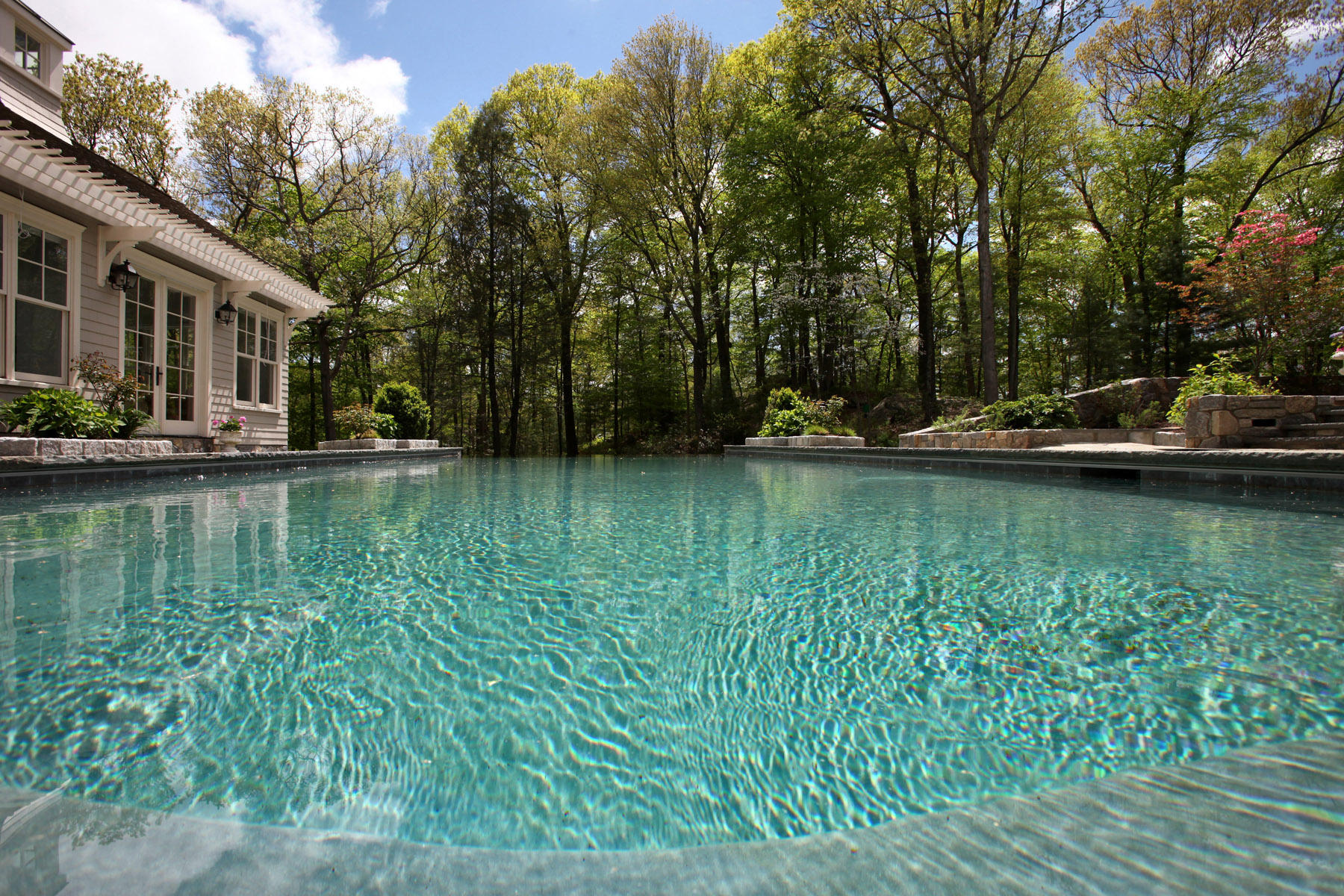 153 Chichester Road New Canaan, CT 06840 - Photo 25 of 32 a view of a lake with houses