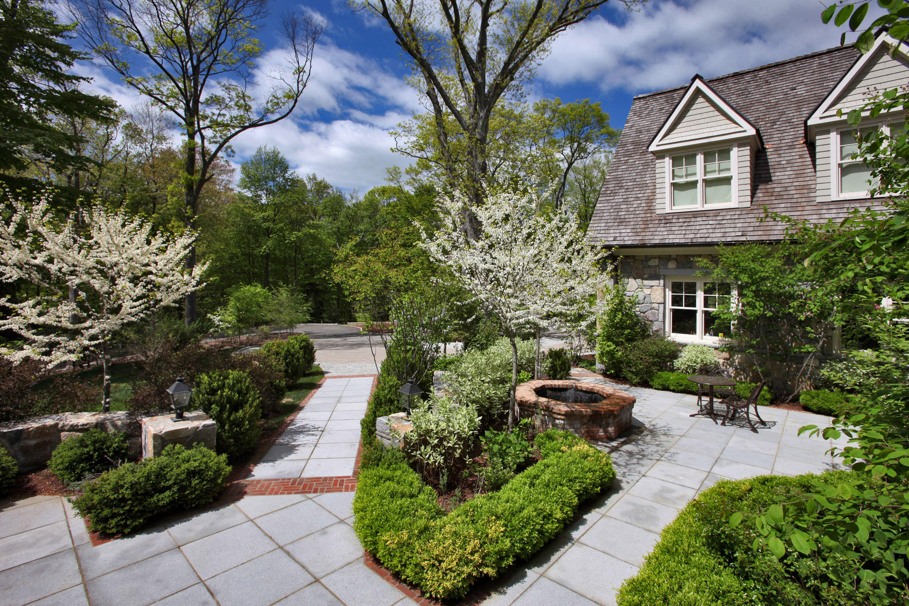 153 Chichester Road New Canaan, CT 06840 - Photo 3 of 32 a view of a yard with potted plants