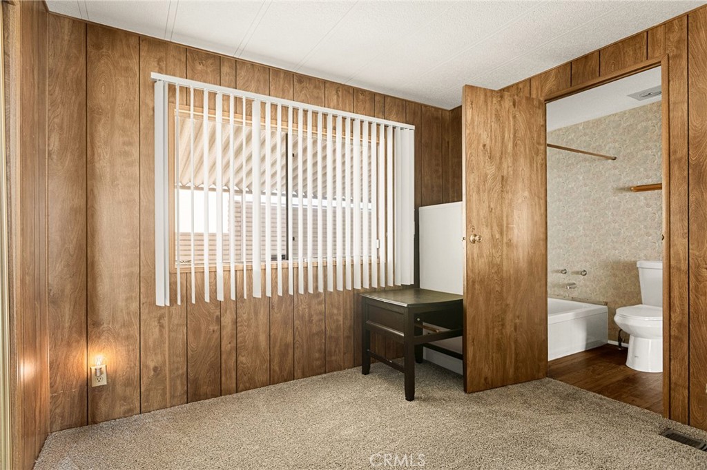 12367 4th Street Yucaipa, CA 92399 - Photo 14 of 19 a view of a bathroom with a toilet and a shower